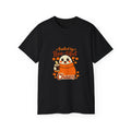 A black short-sleeve crewneck t-shirt featuring a cartoon graphic of a ghost in an orange sweater holding a coffee cup, surrounded by the text 'Fueled by Boo-tiful Chaos' and orange leaves, shown on a plain white background.