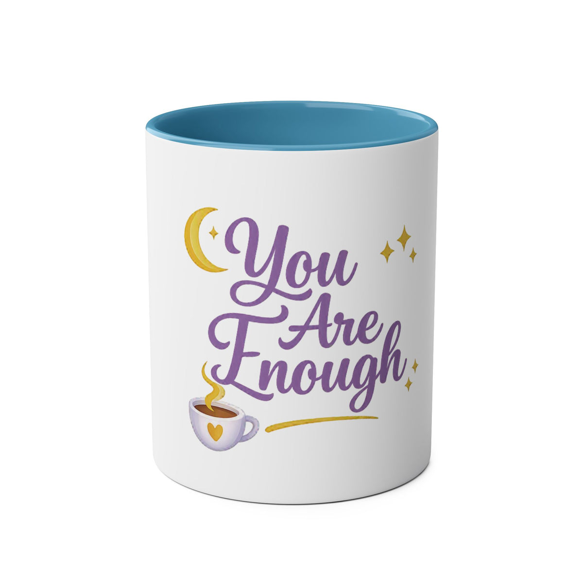 A white ceramic mug with a blue interior, featuring the printed phrase 'You Are Enough' in purple script, accompanied by a yellow crescent moon, yellow stars, and a small coffee cup illustration.