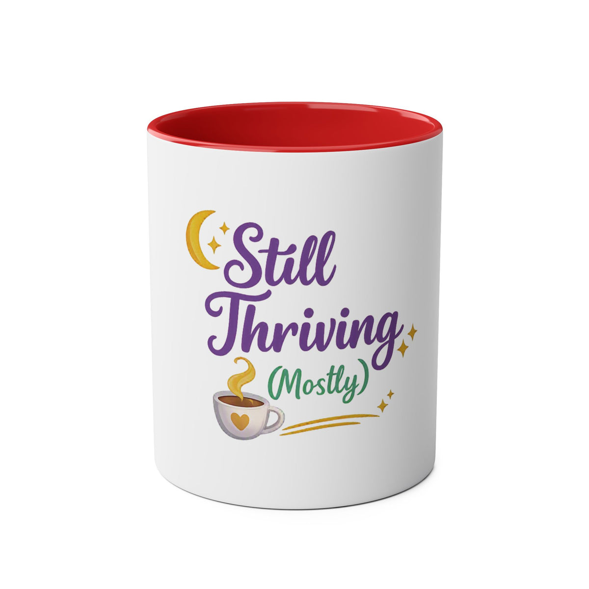 A white ceramic mug with a red interior, featuring a graphic design on the front that reads 'Still Thriving (Mostly)' in purple and green lettering, accompanied by a yellow crescent moon, stars, and a small coffee cup illustration.