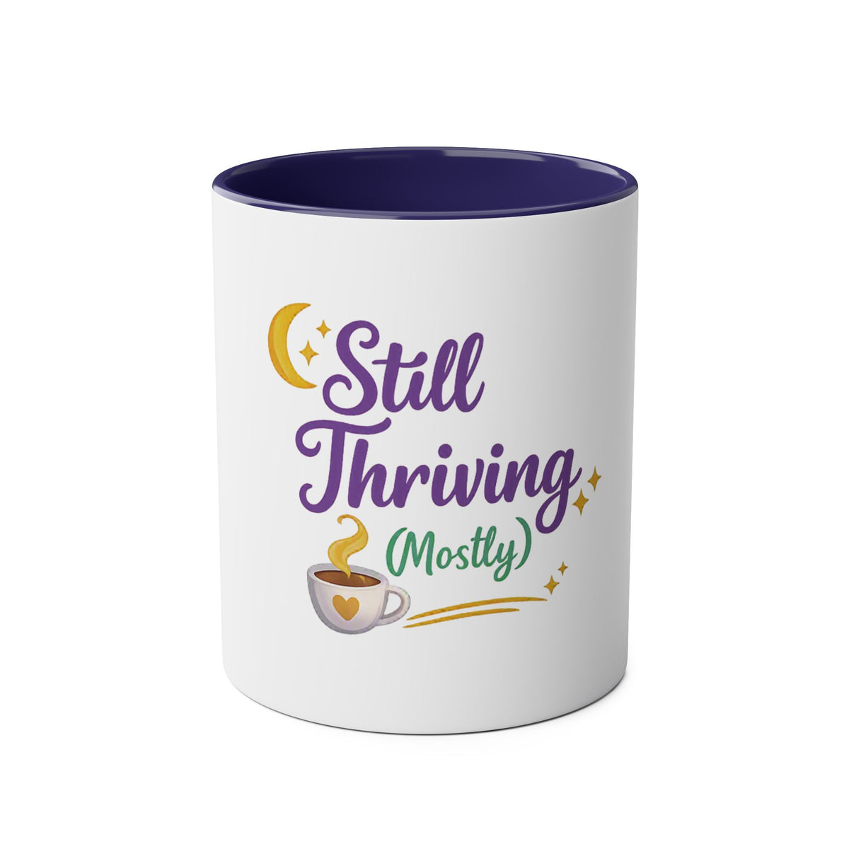 A white ceramic mug with a dark purple interior, featuring a graphic design on the front that reads 'Still Thriving (Mostly)' in purple and green lettering, accompanied by a yellow crescent moon, stars, and a small coffee cup illustration.